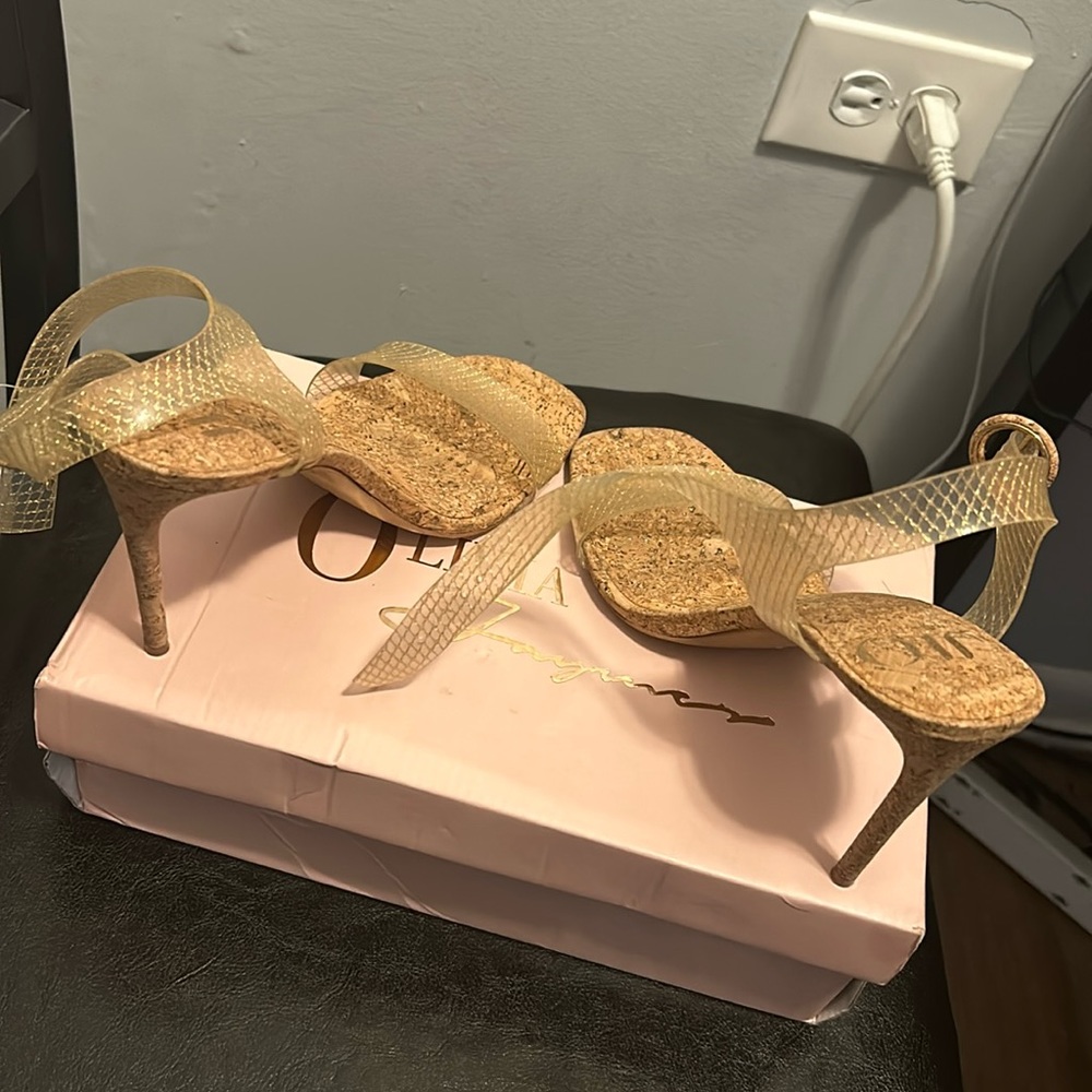 Brown JLO heels with gold specks on the inside and a gold band